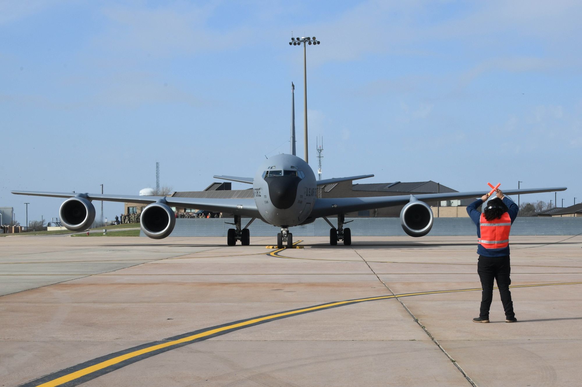 Andrew Gloria, 97th Aircraft Maintenance Squadron aircraft attendant, stands in front of a KC-135 Stratotanker during a large force exercise at Altus Air Force Base, Oklahoma, March 24, 2023. Airmen from the 97th Maintenance Group generated 20 aircraft for the exercise. (U.S. Air Force photo by Airman 1st Class Miyah Gray)