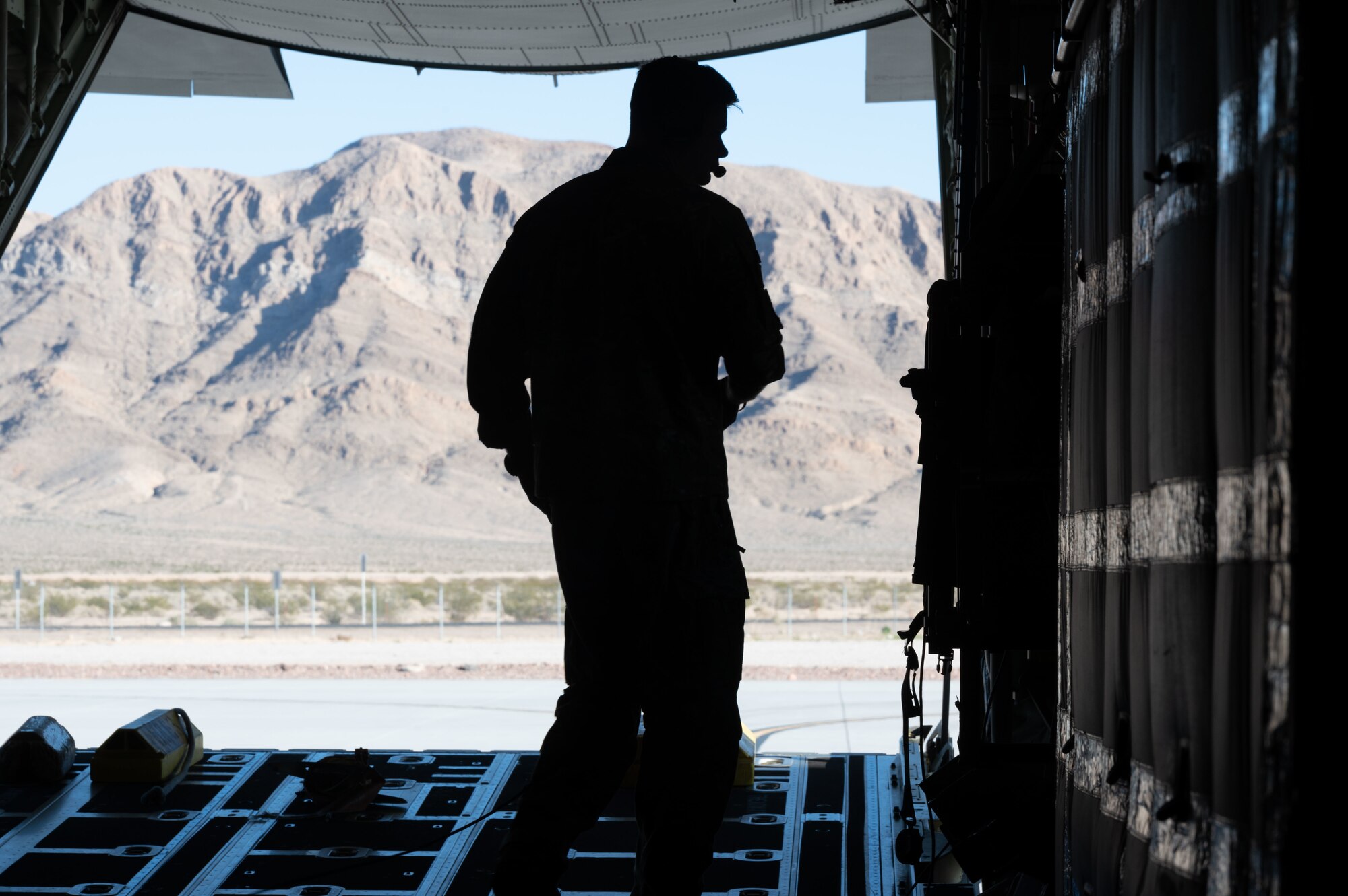 U.S. Air Force Master Sgt. David Williams, a loadmaster assigned to the 102nd Rescue Squadron, New York Air National Guard, 102nd Rescue Squadron, inspects the back of an HC-130J Combat King II after an exercise during Red Flag-Nellis 23-2 at Nellis Air Force Base, Nevada, March 16, 2023.