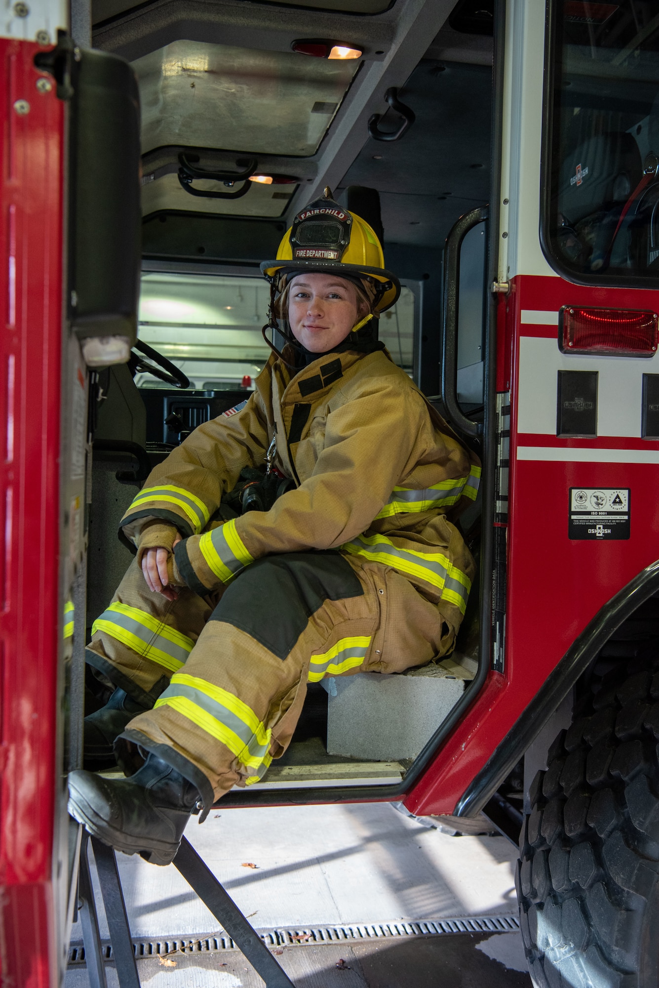 U.S. Air Force Senior Airman Layla Rice, firefighter assigned to the 92nd Civil Engineer Squadron Fire Department, poses in a fire truck at Fairchild Air Force Base, Washington, March 8, 2023. Rice is the only female active-duty firefighter stationed at Fairchild Air Force Base. (U.S. Air Force photo by Airman 1st Class Lillian Patterson)