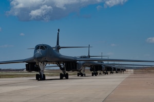 B-1B Lancers taxi onto the flightline at Dyess Air Force Base, Texas, March 24, 2023. Seven B-1s returned to Dyess after being relocated to Holloman AFB, New Mexico, due to possible major storms. The short-notice aircraft relocation demonstrated the agility of 7th Bomb Wing Airmen while confirming Dyess Strikers are ready to implement agile combat employment on a moment's notice. (U.S. Air Force photo by Airman Emma Anderson)