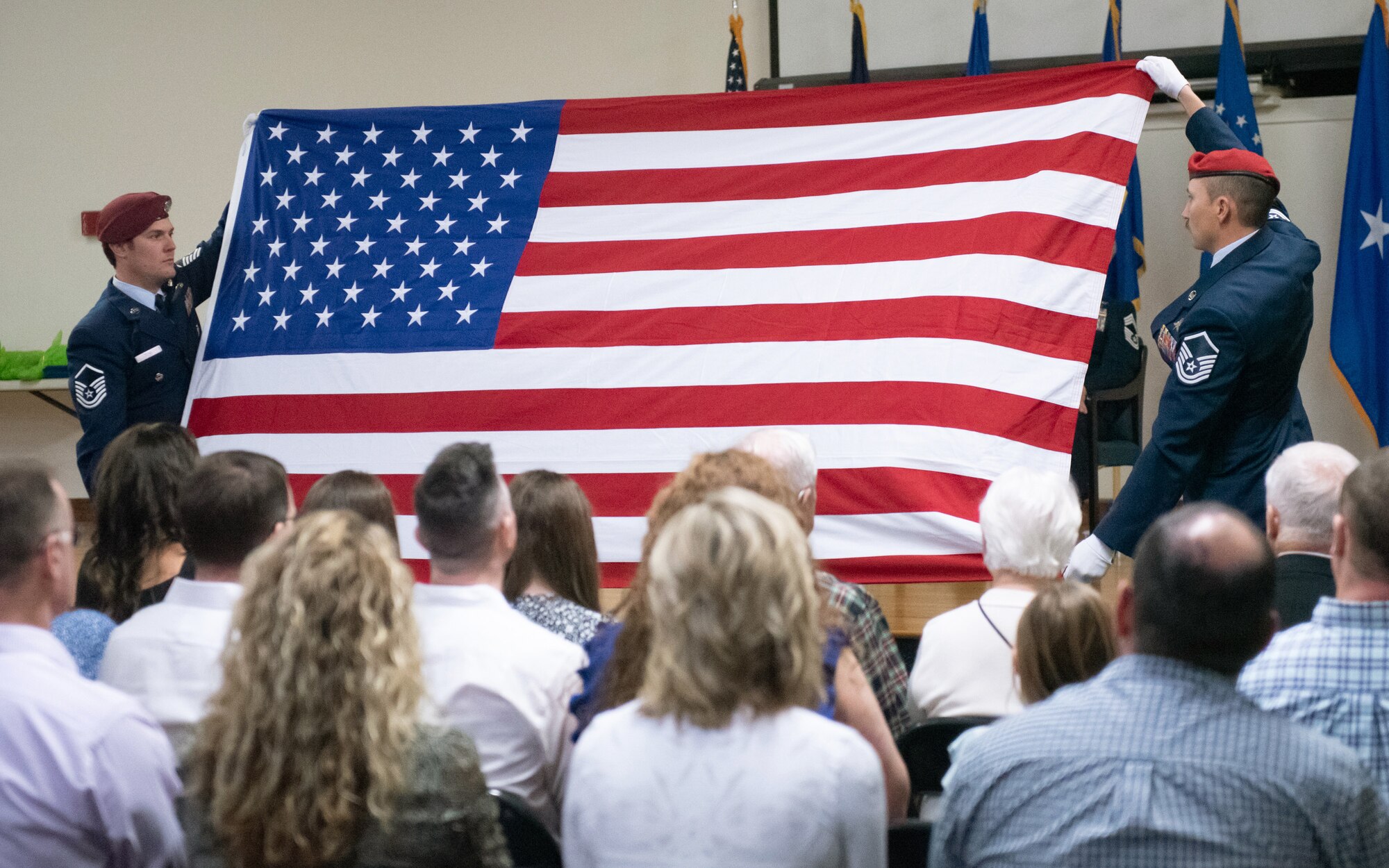 Operators from the 123rd Special Tactics Squadron fold a ceremonial flag for Chief Master Sgt. Karl Grugel, senior enlisted leader of the 123rd Special Tactics Squadron, during his retirement ceremony at the Kentucky Air National Guard Base in Louisville, Ky., Dec. 10, 2022. Grugel served the Air Force and Air National Guard for 31 years. (U.S. Air National Guard photo by Staff Sgt. Clayton Wear)