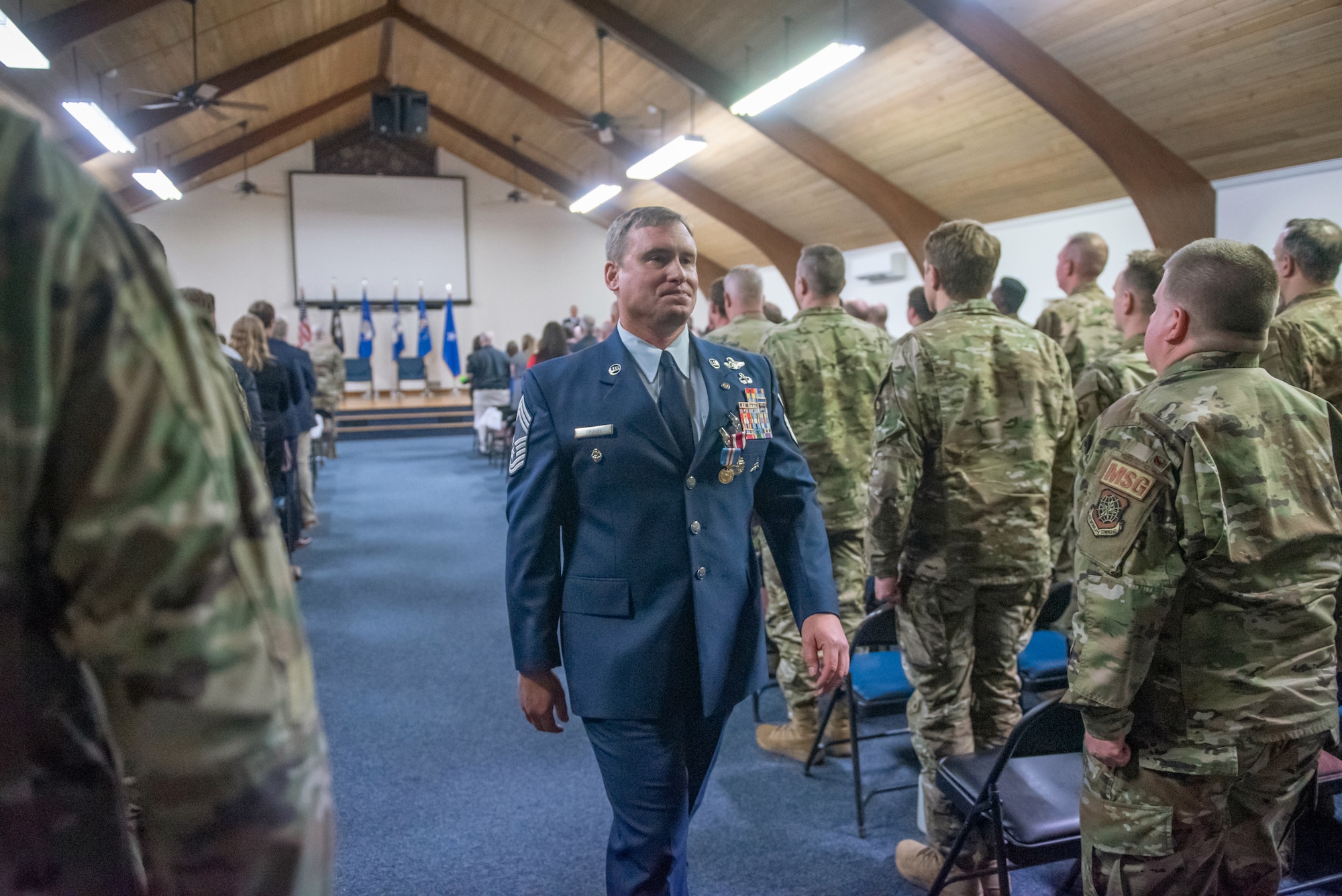 Chief Master Sgt. Karl Grugel, senior enlisted leader of the 123rd Special Tactics Squadron, departs his retirement ceremony at the Kentucky Air National Guard Base in Louisville, Ky., Dec. 10, 2022. During the ceremony, Grugel was awarded the Meritorious Service Medal and the Kentucky Distinguished Service Medal. (U.S. Air National Guard photo by Staff Sgt. Clayton Wear)