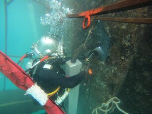 Underwater Construction Team (UCT) 2 work on a pier in Tinian.