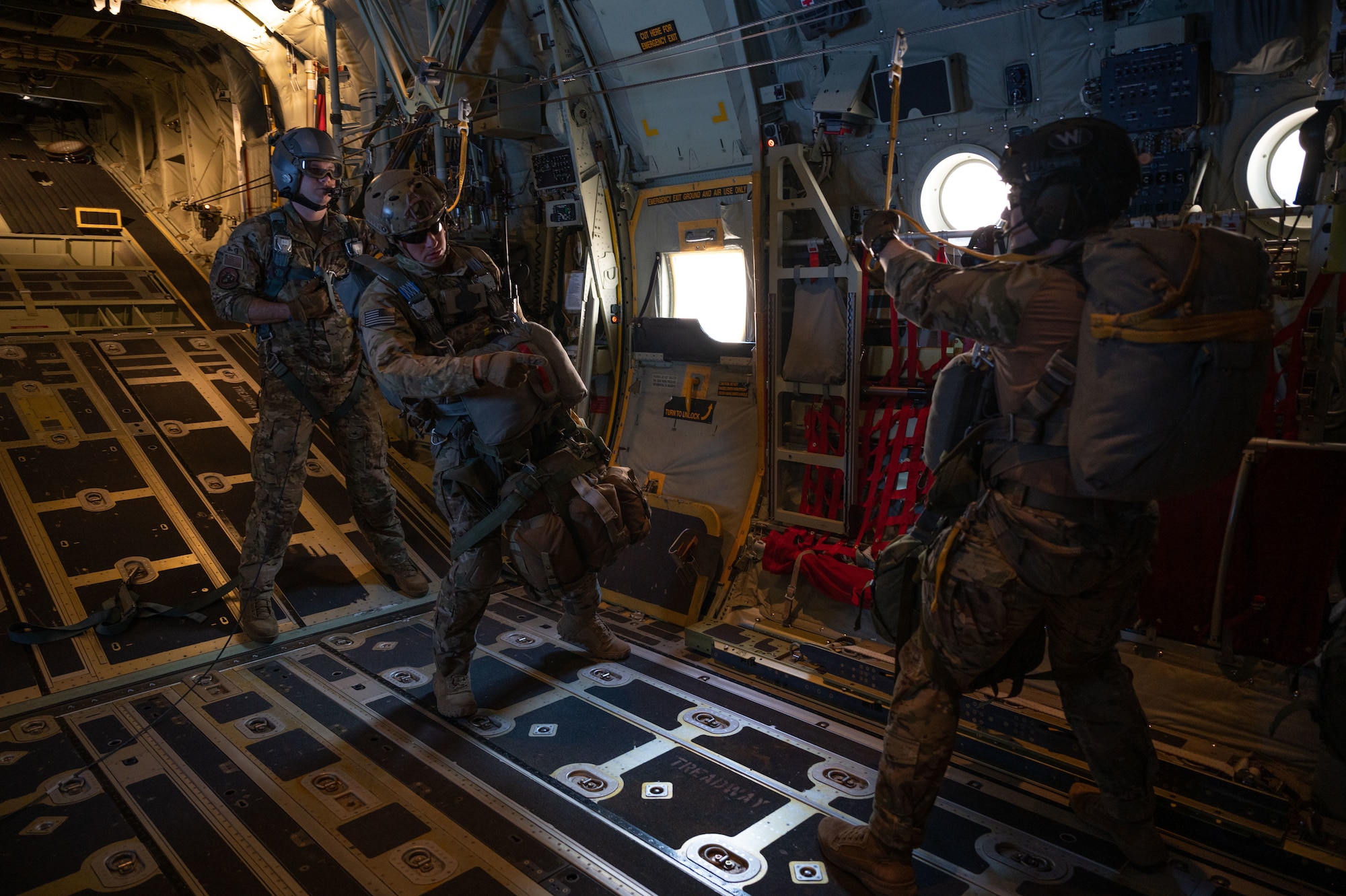Survival, Evasion, Resistance and Escape specialists from Nellis and Edwards Air Force Base prepare to execute a static line exercise during Red Flag-Nellis 23-2 at Nellis Air Force Base, Nevada, March. 16, 2023.