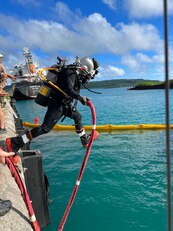 Underwater Construction Team (UCT) 2 work on a pier in Tinian.