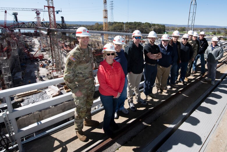 Lt. Col. Joseph Sahl (Far Left), U.S. Army Corps of Engineers Nashville District commander, poses March 20, 2023, with Corps officials and stakeholders overlooking the Chickamauga Lock Replacement Project on the Tennessee River in Chattanooga, Tennessee. The Nashville District hosted a roundtable and provided a tour of the active lock and view of the construction project. (USACE Photo by Lee Roberts)