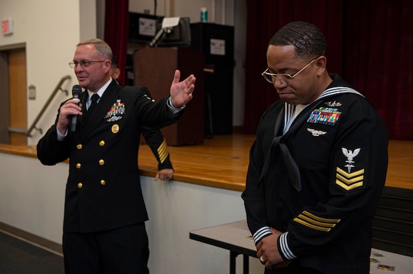 Naval Medical Forces Atlantic (NMFL) Command Master Chief Zachary Pryor, left, congratulates Hospital Corpsman 1st Class Travis Hunter, assigned to Navy Medicine Readiness and Training Command (NMRTC) Rota, on being recognized as the 2022 Regional Naval Medical Forces Atlantic (NMFL) Sailor of the Year (SOY) onboard Naval Support Activity (NSA) Portsmouth-Annex, March 24, 2023.