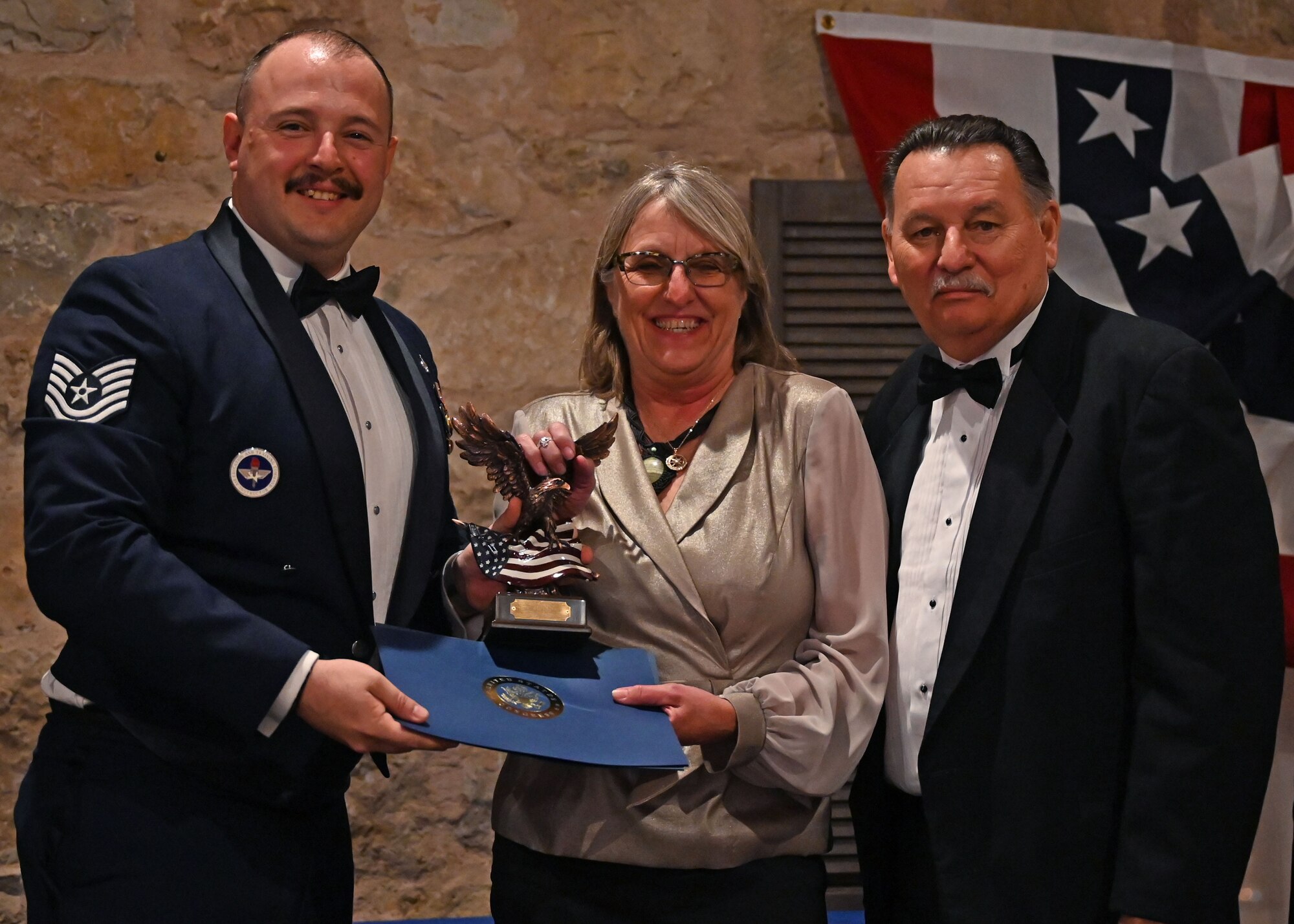 U.S. Air Force Tech. Sgt. Andrew Fruehan, 17th Training Wing Protocol superintendent, presents an award to the San Angelo Elks Lodge 1880 at the Inaugural Veterans Awards Ball in San Angelo, Texas, March 25, 2023. The All Veterans Council recognized the Elks Lodge and other organizations for their efforts in supporting the community. (U.S. Air Force photo by Senior Airman Ethan Sherwood)