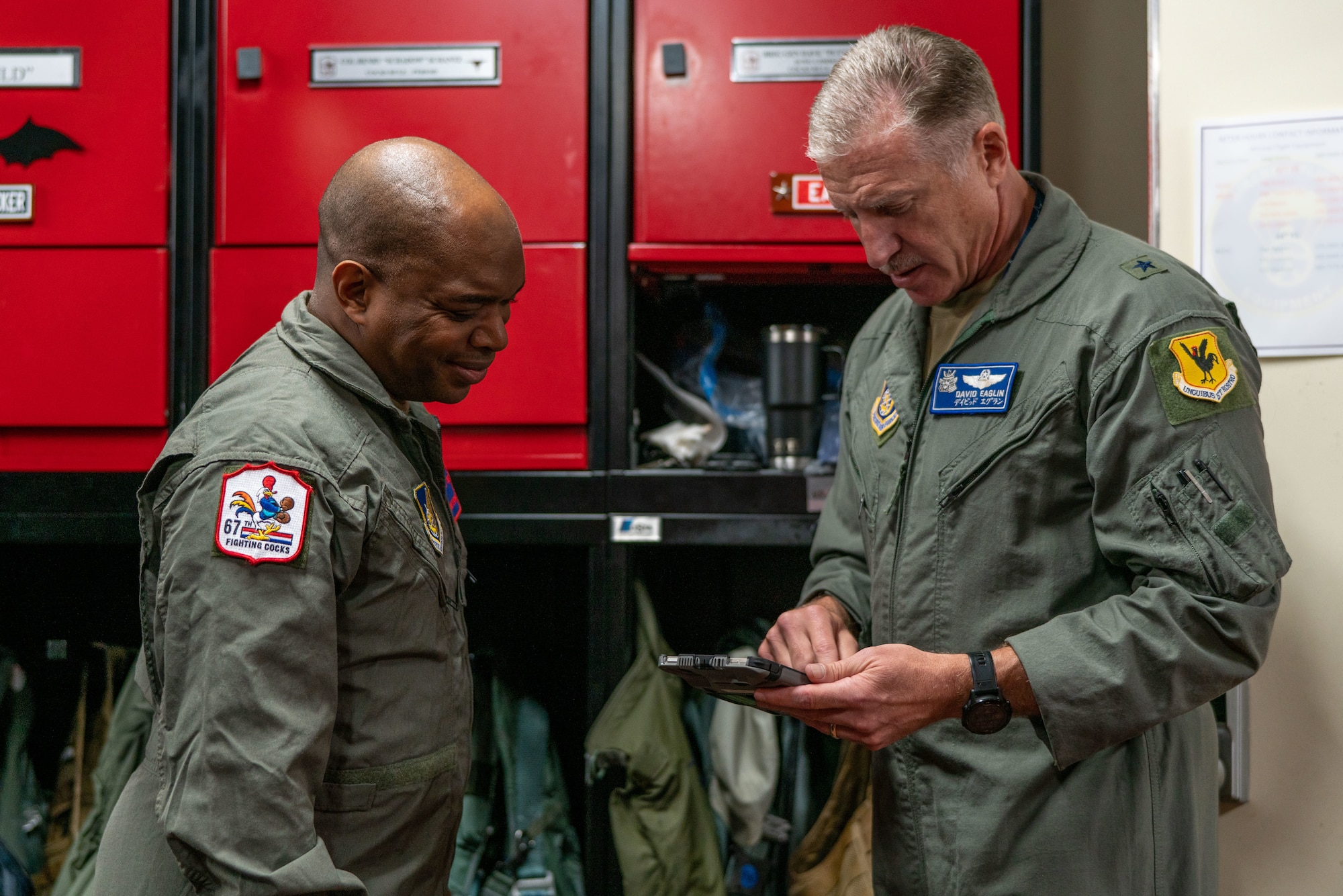 Airmen look at preflight documents.