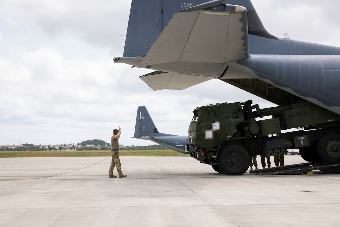 U.S. Marines assigned to 3d Battalion, 12th Marines, and U.S. Airmen with the 353rd Special Operations Wing load an M142 High Mobility Artillery Rocket System onto a U.S. Air Force MC-130J Commando II at Kadena Air Base on Okinawa, Japan for a HIMARS Rapid Infiltration in support of exercise Freedom Shield in the Republic of Korea, March 19, 2023. Freedom Shield 23 is a defense-oriented exercise designed to strengthen the ROK-U.S. Alliance, enhance combined defense posture, and strengthen security and stability on the Korean peninsula. (U.S. Marine Corps photo by Staff Sgt. Abrey D. Liggins)