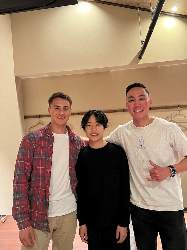 U.S. Marines Corps Sergeants Tyler Rallo (left) and Ryan Cartwright (right), with 1st Battalion, 7th Marines, smile with Reichi Sekiguchi during a dinner at a local restaurant in Kyoto, Japan Feb. 25, 2022. U.S. Marine Corps Sergeants Ryan Cartwright, Tyler Rallo, and Scott Dike provided first aide to Reichi Sekiguchi, a Japanese teen, immediately after he suffered a serious head injury during a snowboarding accident in Nagano Feb. 11. Cartwright is a native of Cincinnati, Ohio. Rallo is a native of Galloway, New Jersey. (Courtesy Photo)