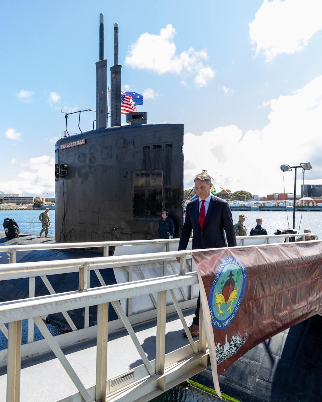 HMAS STIRLING, Australia (March 16, 2023) - Australian Deputy Prime Minister Richard Marles departs the Los Angeles-class fast-attack submarine USS Asheville (SSN 758) following a tour, March 16. Asheville conducted multiple tours for distinguished visitors during a routine port visit to HMAS Stirling, Western Australia to enhance interoperability and communication, and strengthen relationships with the Royal Australian Navy. (Courtesy photo by Australian Department of Defence)