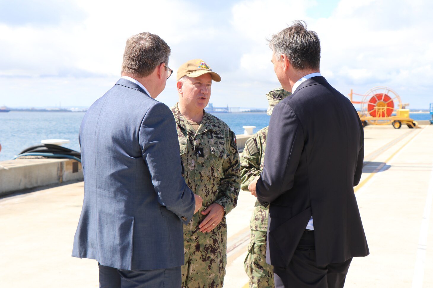 HMAS STIRLING, Australia (March 16, 2023) - Rear Adm. Rick Seif, commander, Submarine Group 7 speaks with Australian Deputy Prime Minister Richard Marles before going onboard the Los Angeles-class fast-attack submarine USS Asheville (SSN 758) for a tour, March 16. Asheville conducted multiple tours for distinguished visitors during a routine port visit to HMAS Stirling, Western Australia to enhance interoperability and communication, and strengthen relationships with the Royal Australian Navy. (Courtesy photo by Australian Department of Defence)