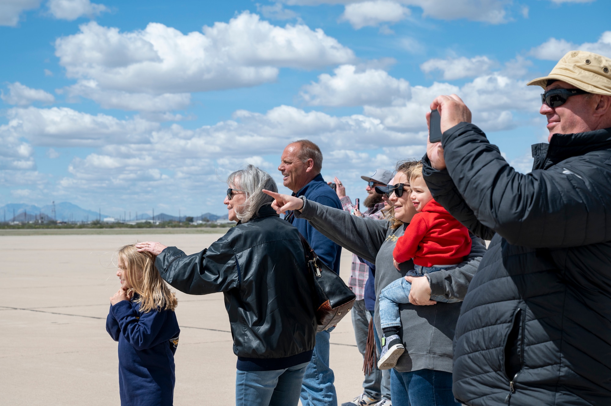 Photo of people looking down the flightline.