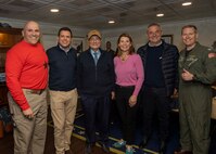 (March 23, 2023)  Rear Adm. Dennis Velez, commander, Carrier Strike Group (CSG) 10, George H.W Bush CSG, left, Gaetano Galvagno, President of the Sicilian Regional Assembly,, second left, President of Sicilian Region Renato Schifani, center left, Tracy Robert-Pounds, Consul General of the United States of America in Naples, center right, Michele Mancuso, Member of the Sicilian Regional Assembly, second right, and Capt. Dave Pollard, commander, Nimitz-class aircraft carrier USS George H.W. Bush (CVN 77), pose for a group photo, March 23, 2023. The George H.W. Bush Carrier Strike Group is on a scheduled deployment in the U.S. Naval Forces Europe area of operations, employed by U.S. Sixth Fleet to defend U.S., allied and partner interests.