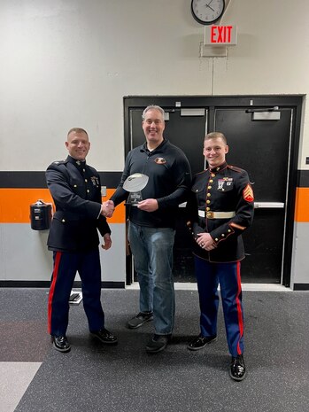 Matt Binsfeld, a coach at Kaukauna High School in Kaukauna, WI, is awarded the Semper Fi Coach Award for his selfless commitment to his team and his community.