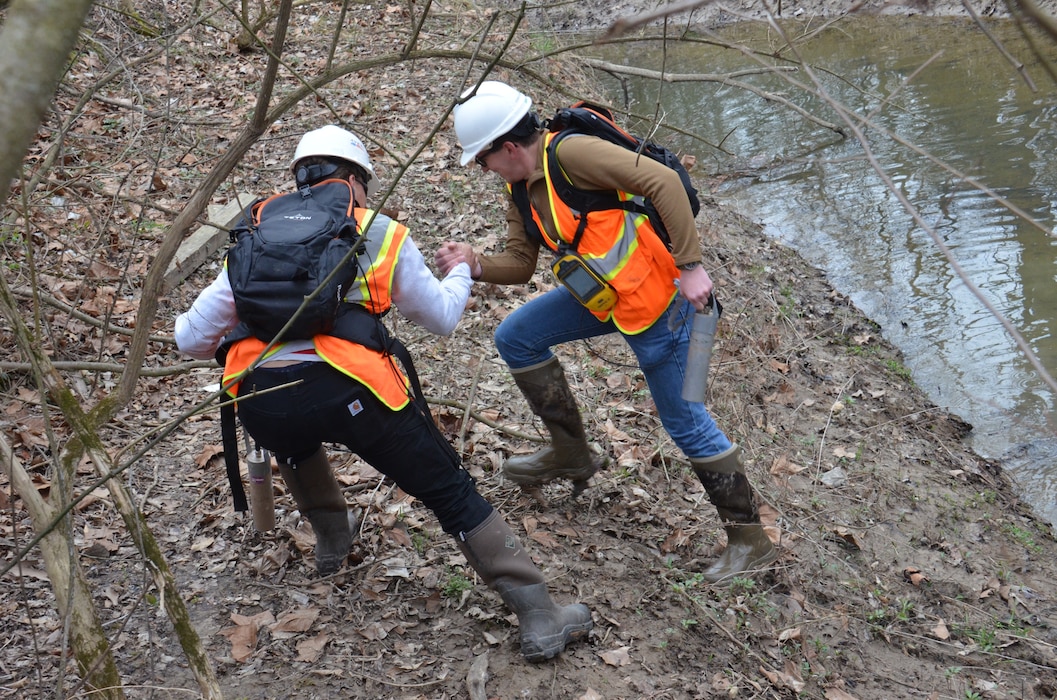 U.S. Army Corps of Engineers Formerly Utilized Sites Remedial Action Program contractors perform gamma walkover surveys along the 100-year floodplain in and around Coldwater Creek, in areas along Highway 367 that were previously inaccessible due to excessive foliage and thick brush. Gamma walkover surveys are completed to identify areas where there may be elevated areas of Manhattan Engineer District, early Atomic Energy Commission radiation that require further investigation. The team frequently braves mucky slopes and harsh terrain to keep the FUSRAP mission on track.