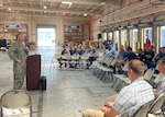 A group gathers to talk logistics in Guam.