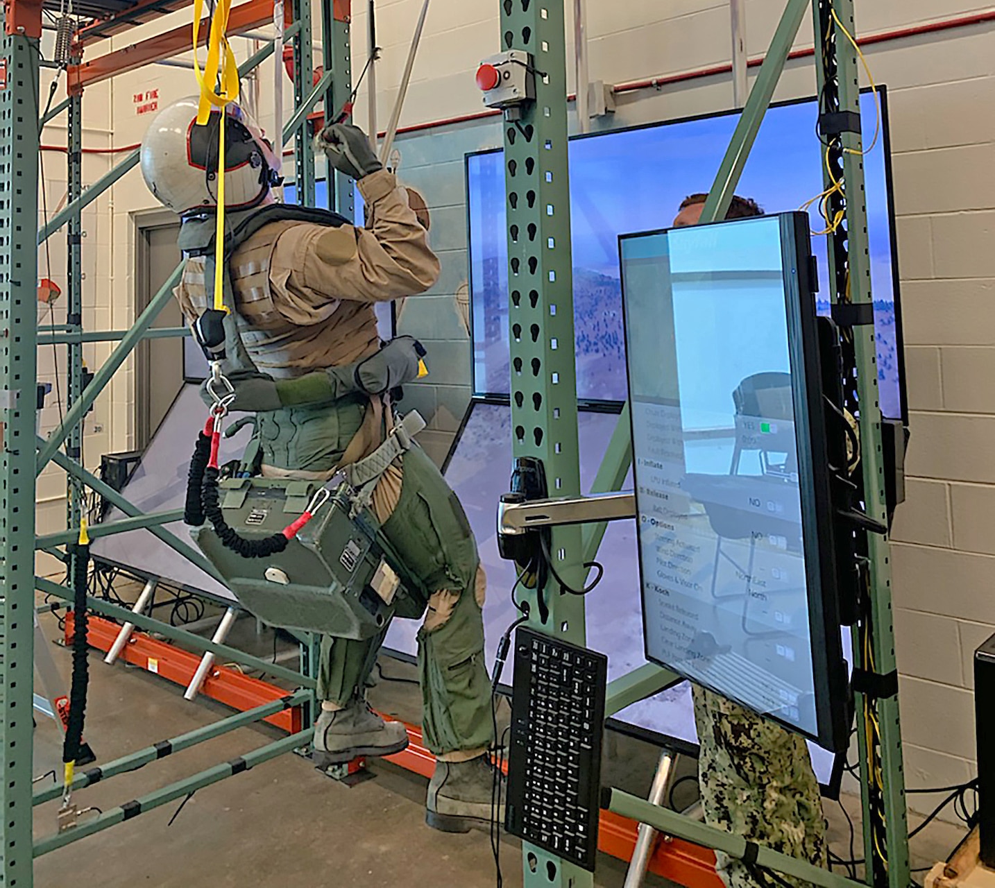 A student performs corrective action in response to a parachute malfunction during training at Aviation Survival Training Center (ASTC) Pensacola, Florida.