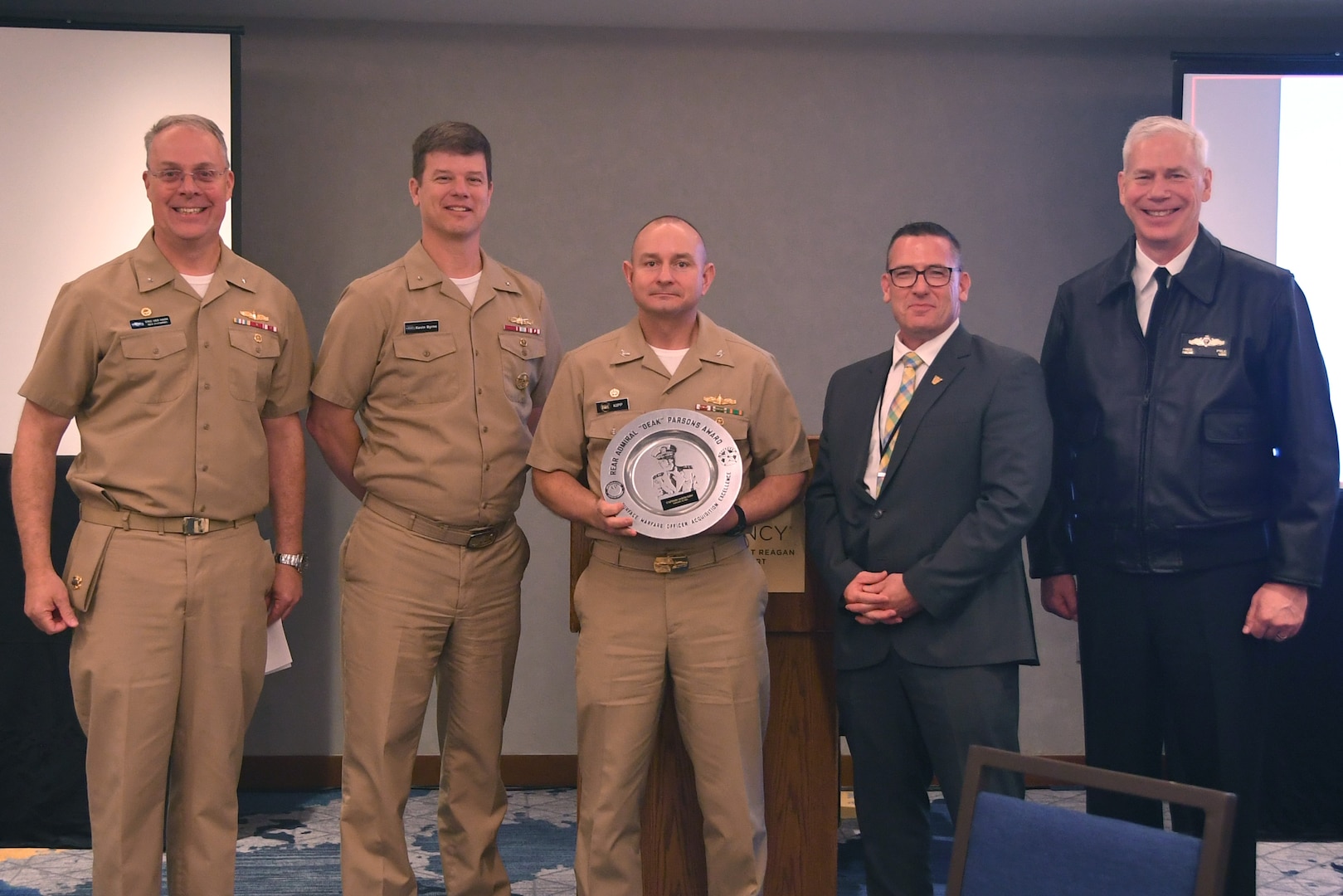 (From left to right) Rear Adm. Eric Ver Hage, Commander for Regional Maintenance Center and NAVSEA director, Surface Ship Maintenance and Modernization, Rear Adm. Kevin Byrne, Commander of Naval Surface Warfare Center and Naval Undersea Warfare Center, Capt. Jason D Kipp, Major Program Manager, Program Executive Office Atalanta Integrated Warfare Systems 8.0, Jim Day, Executive Director for Surface Warfare Division, N96, Office of the Chief of Naval Operations, Rear Adm. Fred Pyle, Director for Surface Warfare Division, N96, Office of the Chief of Naval Operations,