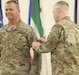 Brig. Gen. Robert S. Powell, former commander of the 335th Signal Command (Theater) (Provisional), is pinned with the Army Central Command unit patch by Lt. Gen. Patrick Frank, commanding general of United States Army Central, March 20, 2023, on Camp Arifjan, Kuwait. Powell assumes his new position as the deputy chief of staff for Army Central. (U.S. Army photo by Spc. Rhema Eggleston)