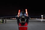 Maintainers from the 28th Aircraft Maintenance Squadron marshall a B-1B Lancer into position  after it returns from Nellis Air Force Base, Nevada, at Ellsworth AFB, South Dakota, March 24, 2023.
