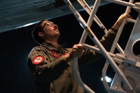 Capt. Colin Blount, 34th Bomb Squadron air crew member, unloads cargo from a B-1B Lancer upon returning from Nellis Air Force Base, Nevada, at Ellsworth AFB, South Dakota, March 24, 2023.