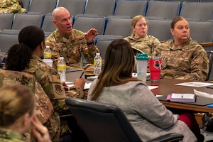 Maj. Gen. Michael J. Lutton, 20th Air Force commander, speaks with Women’s Initiative Team members at a two-day conference March 21, 2023, at Malmstrom Air Force Base, Mont. Lutton discussed the new policy change recently signed by Gen. Thomas A. Bussiere, Air Force Global Strike Command commander, allowing pregnant Airmen access to prenatal medical care while maintaining informational privacy. (U.S. Air Force photo by Airman Hannah Hardy)