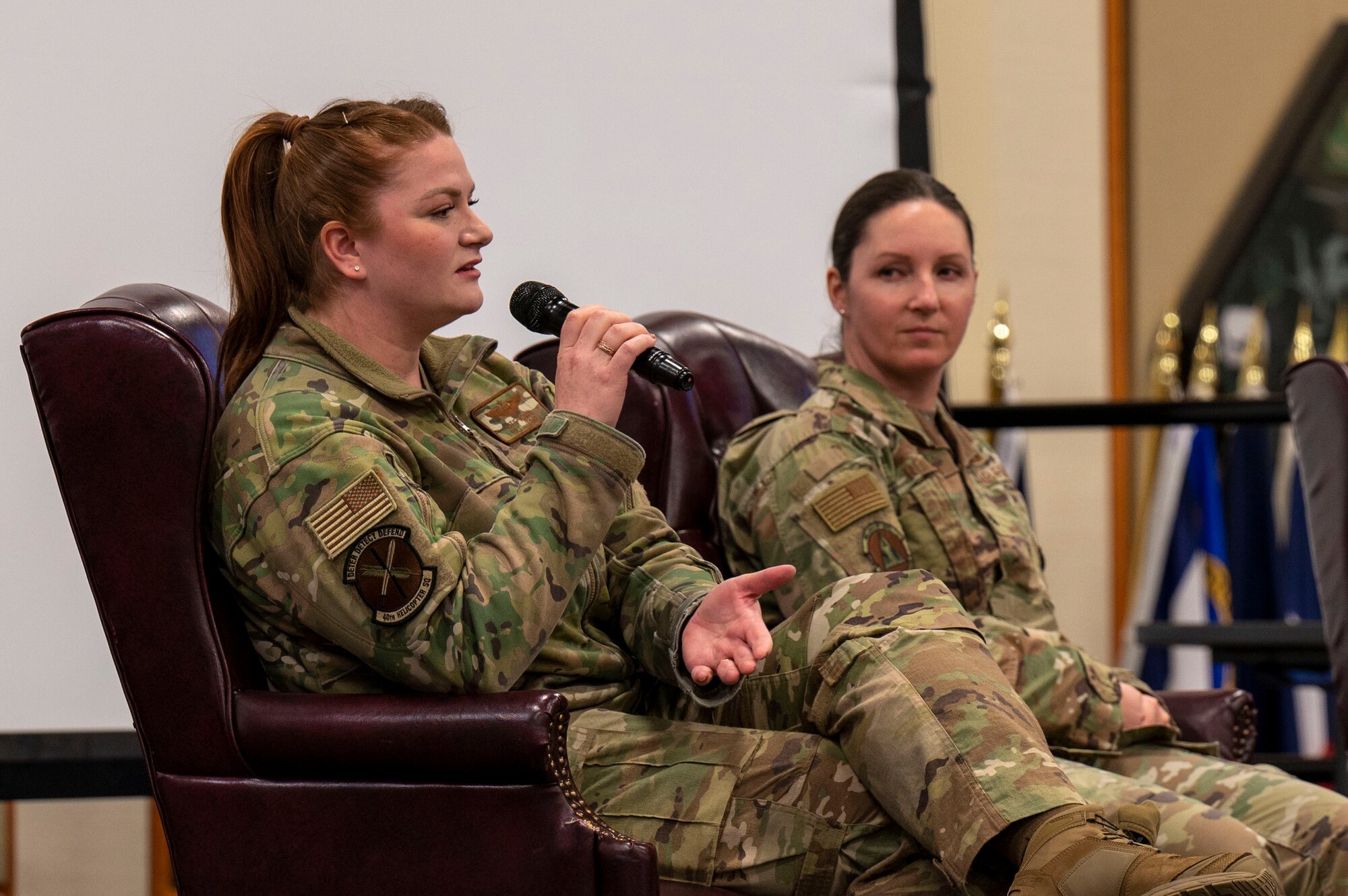 Maj. Katherine Roman, 40th Helicopter Squadron chief resource advisor, left, and Lt. Col. Julie Roloson, 341st Security Forces Squadron commander, speak at an all-female officers' panel during a women's leadership symposium March 21, 2023, at Malmstrom Air Force Base, Mont The two-day symposium was open to all on base and covered a wide range of topics to include leadership, mentorship, retention, wellness and readiness. (U.S. Air Force photo by Airman Hannah Hardy)