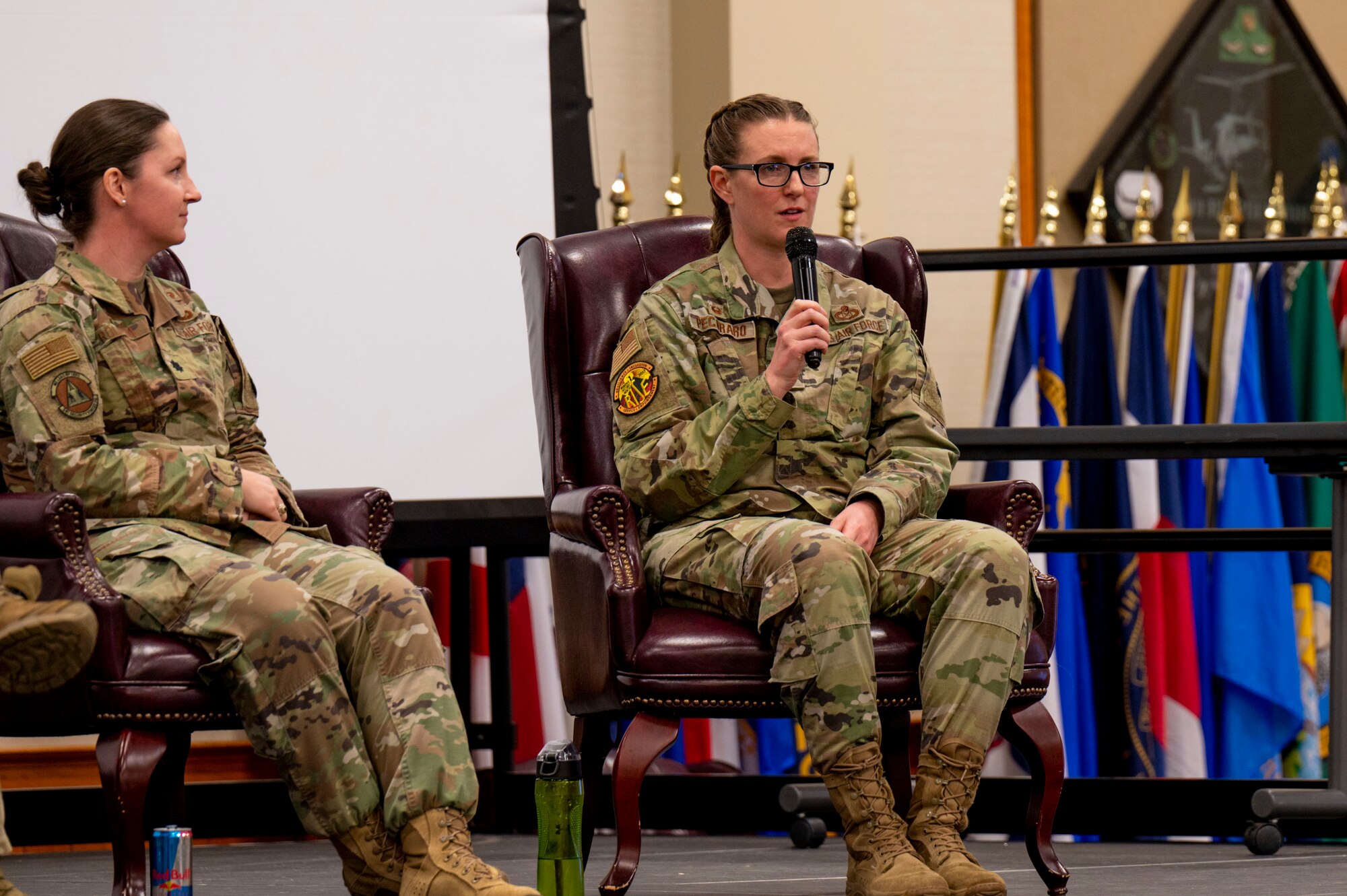 Lt. Col. Julie Roloson, 341st Security Forces Squadron commander, left, and Lt. Col. Corrie Pecoraro, 341st Force Support Squadron commander, speak at an all-female officers' panel during a women's leadership symposium March 21, 2023, at Malmstrom Air Force Base, Mont. Roloson and Pecoraro addressed topics to include combating burnout and strategies to focus on overall well-being. (U.S. Air Force photo by Airman Hannah Hardy)