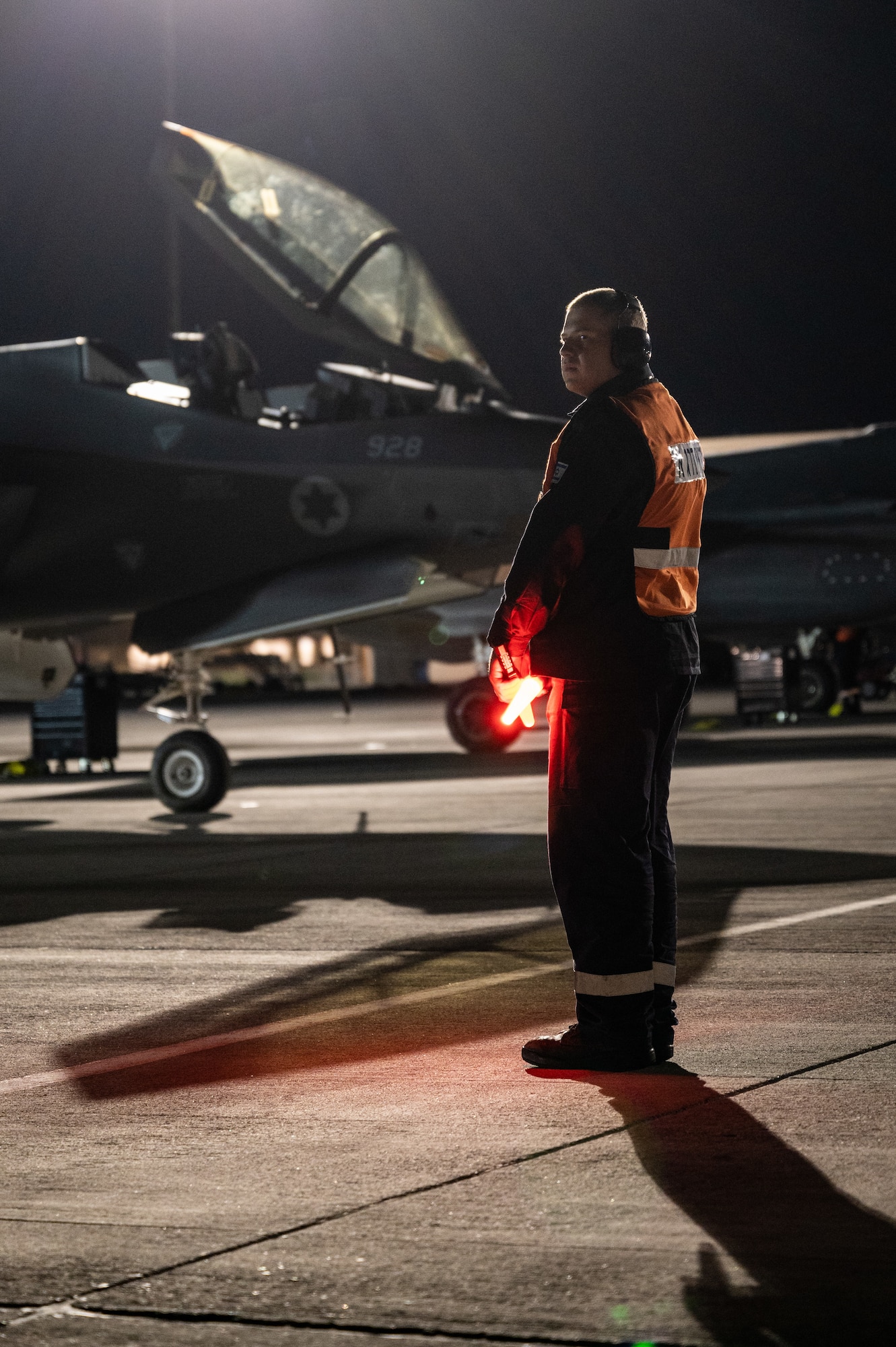 An Israeli Air Force member marshals an F-35I Adir prior to a a Red Flag-Nellis 23-2 mission at Nellis Air Force Base, Nevada, March 16, 2023.