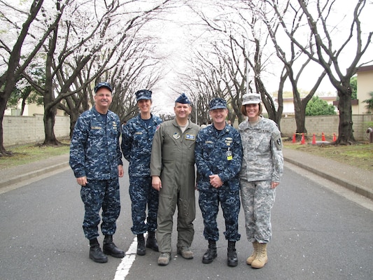 Navy Captain Bruce Gillingham poses for a photo with the Joint U.S. medical team in Japan supporting operation Tomodachi following the March 11th, 2011 earthquake.