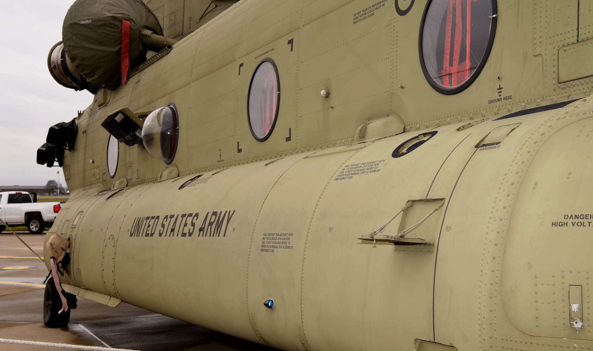 A U.S. Army CH-47F Chinook helicopter from the 1st Battalion, 214th Aviation Regiment (General Support Aviation Battalion), 12th Combat Aviation Brigade, Wiesbaden, Germany, sits on the flightline at Royal Air Force Mildenhall, England, March 16, 2023. The 12 CAB is among other units assigned to V Corps, America's Forward Deployed Corps in Europe. They work alongside NATO Allies and regional security partners to provide combat-ready forces, execute joint and multinational training exercises, and retain command and control for all rotational and assigned units in the European theater. (U.S. Air Force photo by Karen Abeyasekere)