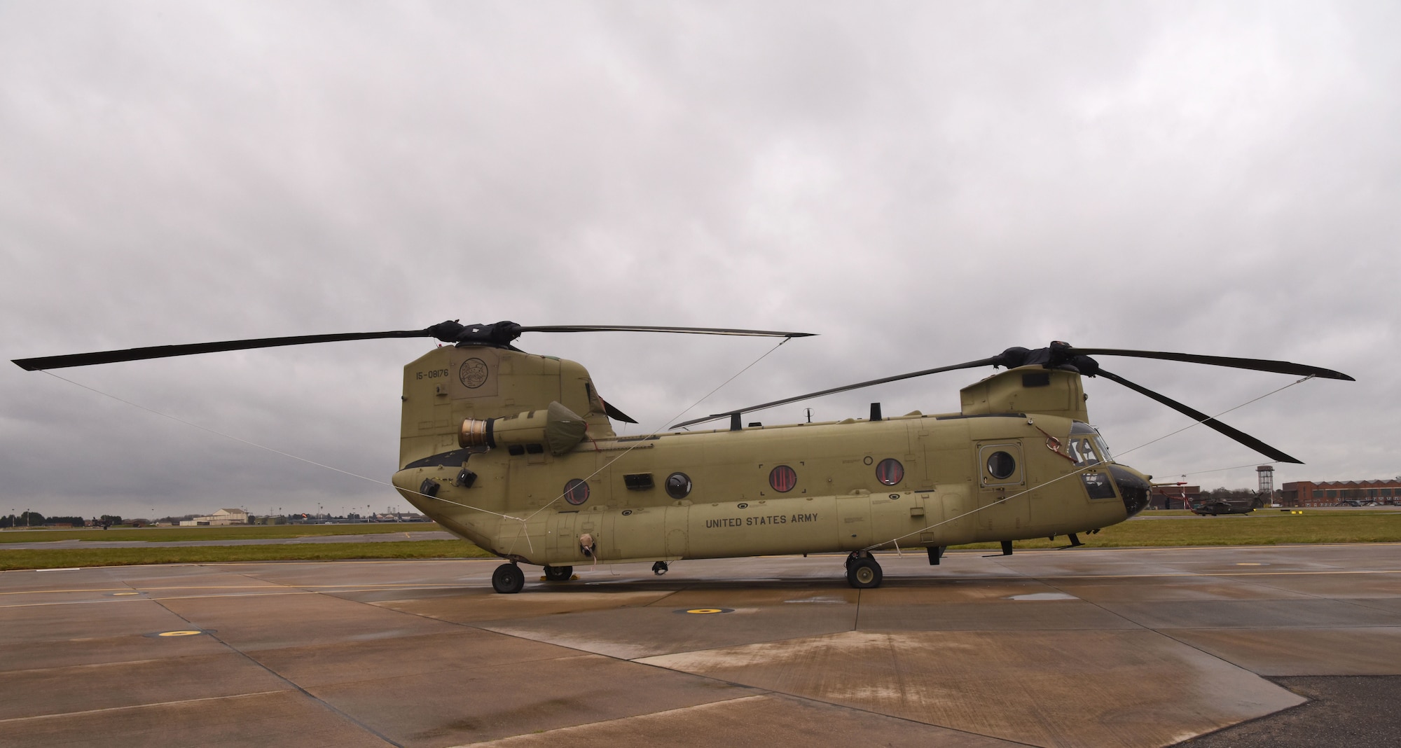 A U.S. Army CH-47F Chinook helicopter from the 1st Battalion, 214th Aviation Regiment (General Support Aviation Battalion), 12th Combat Aviation Brigade, Wiesbaden, Germany, sits on the flightline at Royal Air Force Mildenhall, England, March 16, 2023. The 12 CAB is among other units assigned to V Corps, America's Forward Deployed Corps in Europe. They work alongside NATO Allies and regional security partners to provide combat-ready forces, execute joint and multinational training exercises, and retain command and control for all rotational and assigned units in the European theater. (U.S. Air Force photo by Karen Abeyasekere)