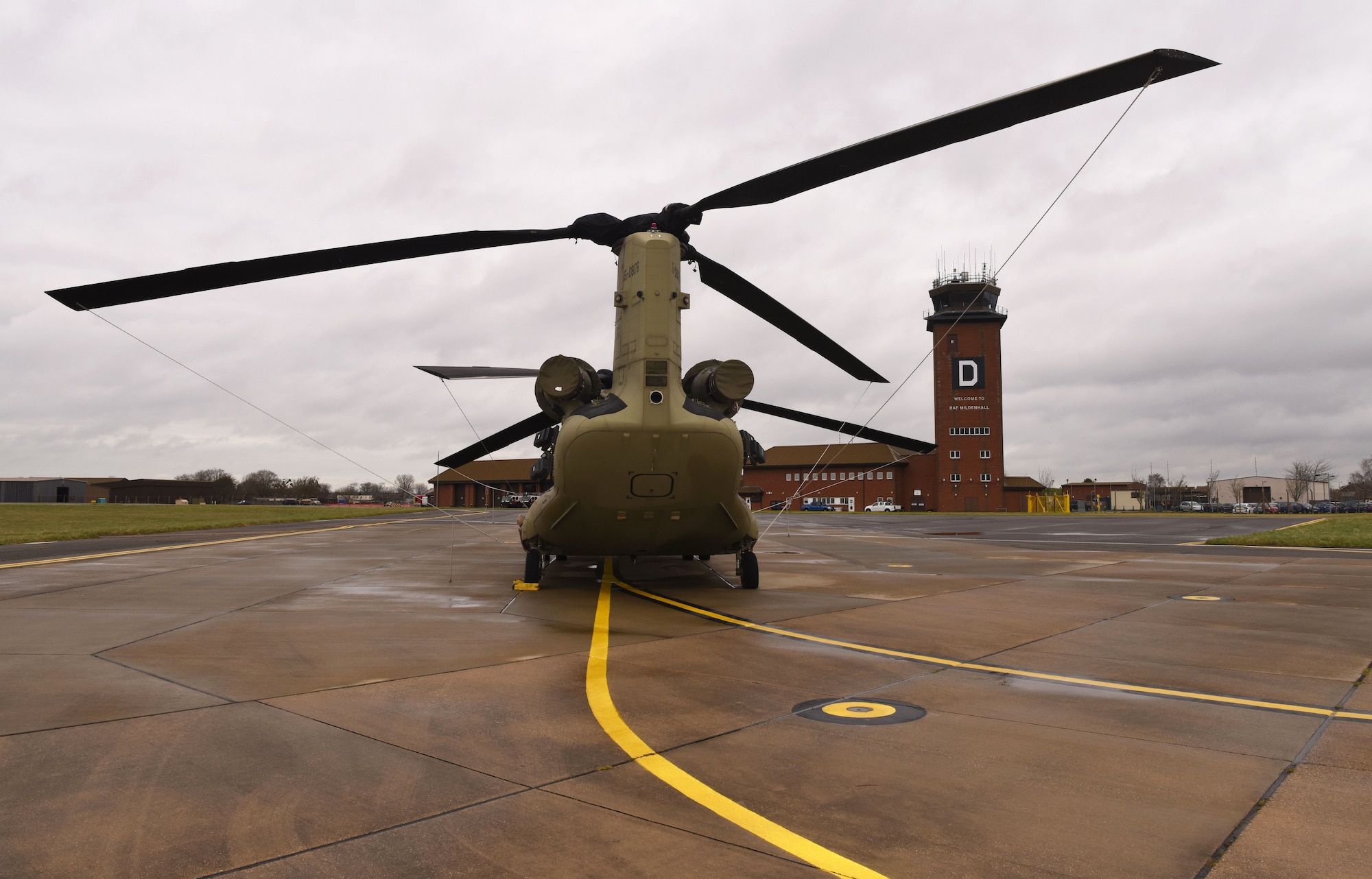 A U.S. Army CH-47F Chinook helicopter from the 1st Battalion, 214th Aviation Regiment (General Support Aviation Battalion), 12th Combat Aviation Brigade, Wiesbaden, Germany, sits on the flightline at Royal Air Force Mildenhall, England, March 16, 2023. The 12 CAB is among other units assigned to V Corps, America's Forward Deployed Corps in Europe. They work alongside NATO Allies and regional security partners to provide combat-ready forces, execute joint and multinational training exercises, and retain command and control for all rotational and assigned units in the European theater. (U.S. Air Force photo by Karen Abeyasekere)