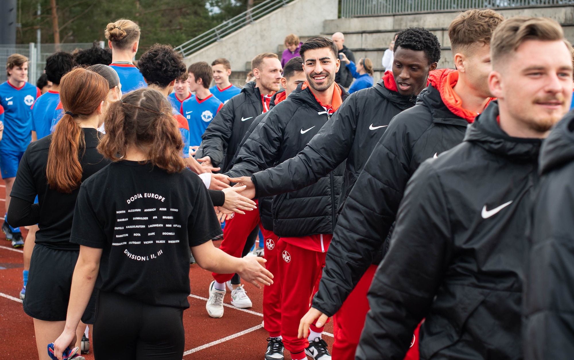 Players from the Football Club Kaiserslautern (1. FCK) team visit Ramstein High School at Ramstein Air Base, Germany, March 23, 2023. While visiting RAB, members of 1.FCK met with fans and participated in a meet-and-greet where they were asked questions and signed memorabilia. (U.S. Air Force photo by Airman 1st Class Jared Lovett)