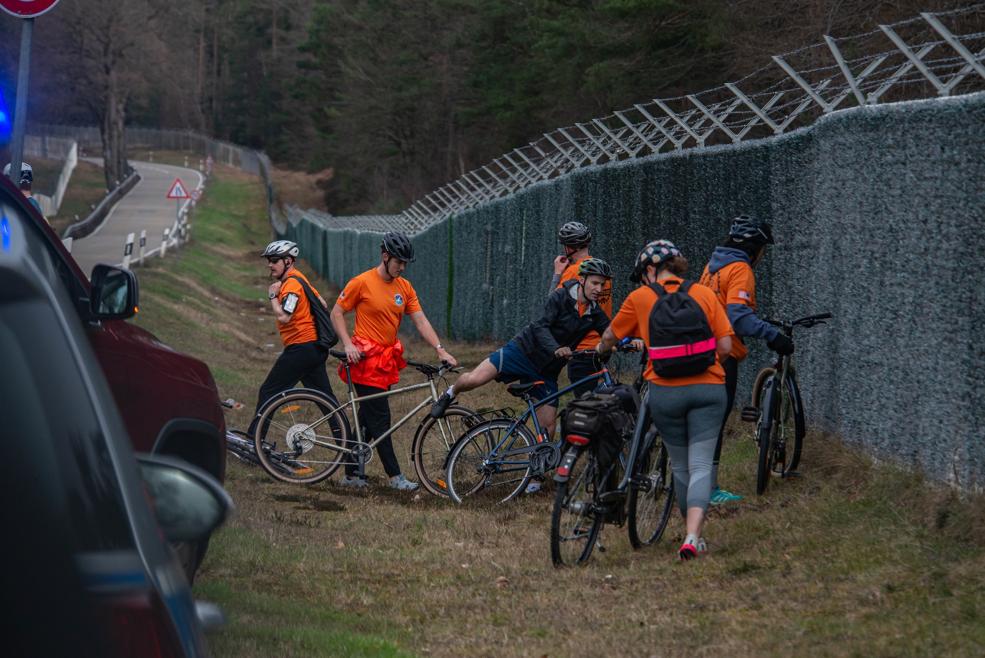 Airmen dismount their bikes