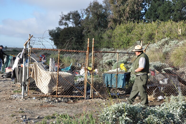 Army Corps of Engineers Los Angeles District surveys an area where trash was dumped next to Reach 12 of the San Gabriel River, March 6, near Azuza, California