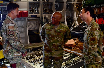 From left to right: Hawaii Air National Guard Staff Sgt. Xiaija Schuldies, a pararescueman with the 48th Rescue Squadron (left), shared a laugh with Senior Enlisted Advisor Tony Whitehead, the SEA to the chief, National Guard Bureau, while Hawaii Air National Guard 1st Lt. Matthew Moawad, a combat rescue officer assigned to the 48th RQS, listens in.