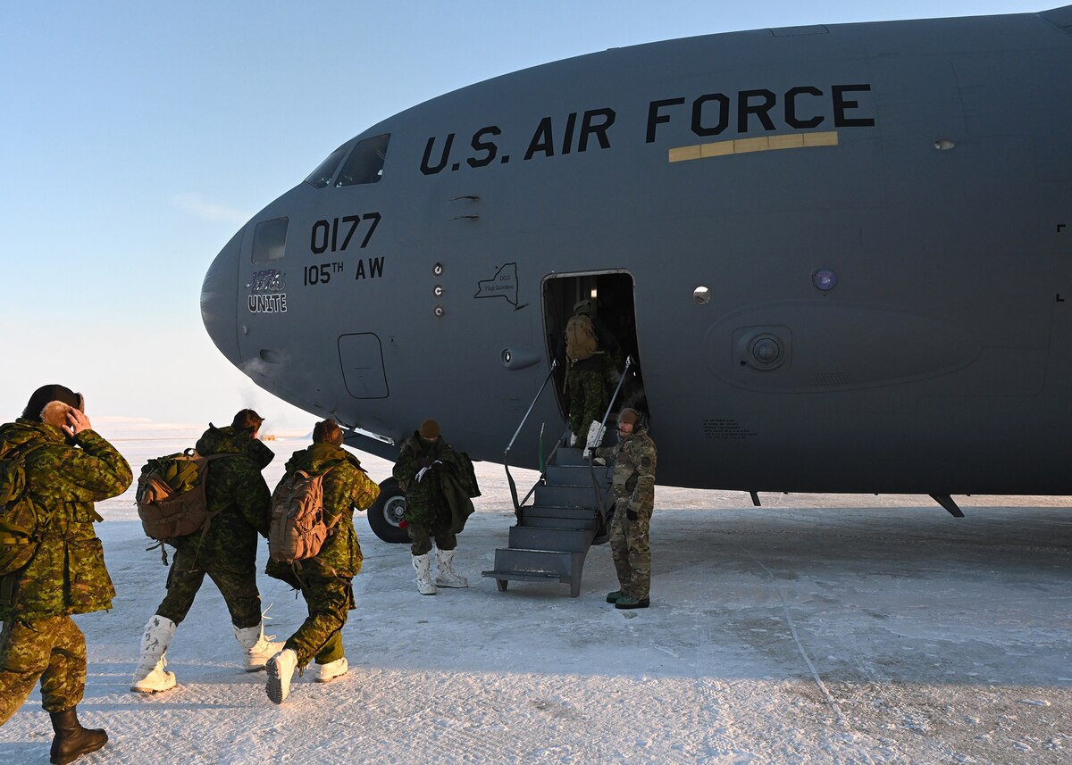Soldiers from the Canadian Armed Forces board a C-17 Globemaster III from the 105th Airlift Wing during exercise Guerrier Nordique at Resolute Bay, Nunavut, Canada March 18, 2023