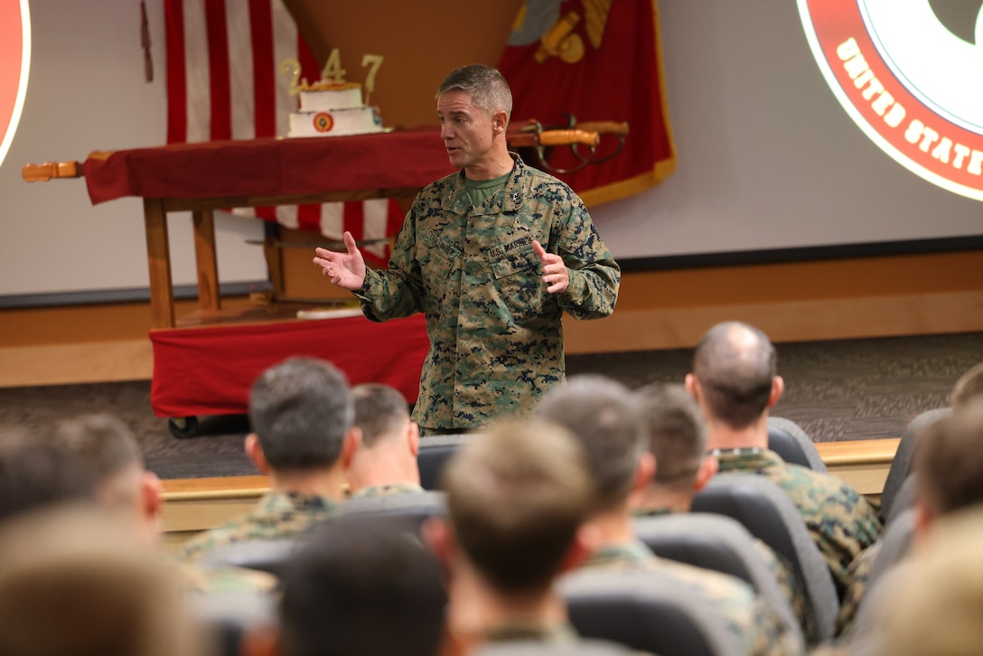Marine Forces Special Operations Command hosts a cake cutting ceremony in celebration of the 247th Marine Corps Birthday at Camp Lejeune, North Carolina, Nov. 10, 2022. It is a Marine Corps Birthday tradition for the oldest and youngest Marine present to share the first slice of cake. Col. Richard Hansen, chief of staff, passed the slice to Lance Cpl. Robert W. Holman, symbolizing the passing of wisdom, knowledge, and experience as well as trust and confidence in those who will carry on our Marine Corps traditions in the future. (U.S. Marine Corps photo by Sgt. Jesula Jeanlouis)