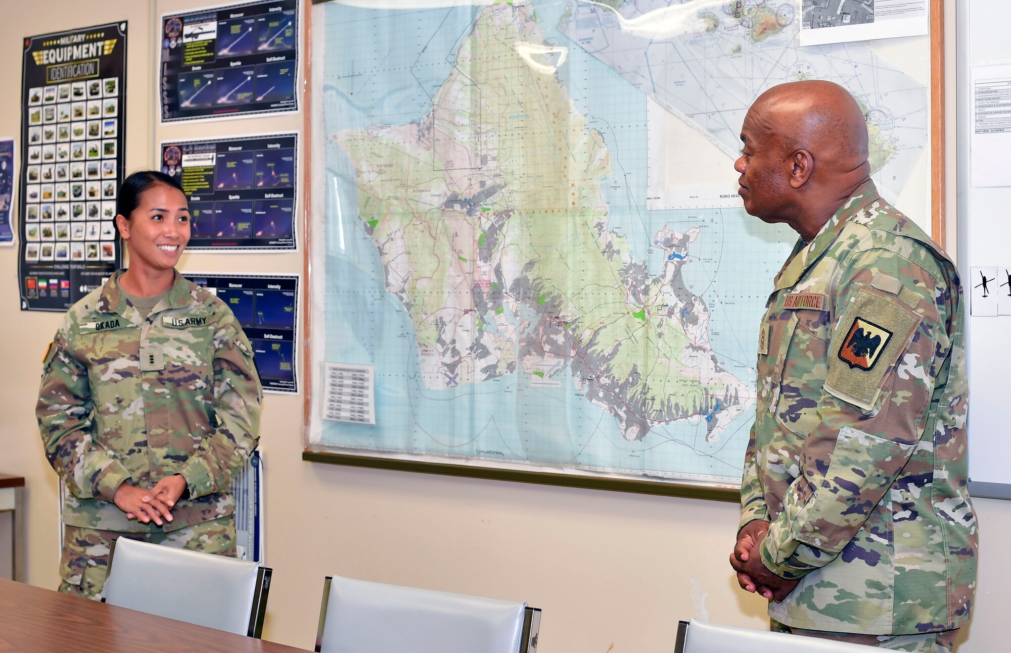 Hawaii Army National Guard Chief Warrant Officer 3 Hau Okada, the training officer for Det 1, G CO 3-126 Aviation Regiment, provides capabilities brief to Senior Enlisted Advisor Tony Whitehead, the SEA to the chief of the National Guard Bureau, on the mission sets of the 1st Battalion, 189th General Support Aviation Battalion stationed at Wheeler Army Airfield.