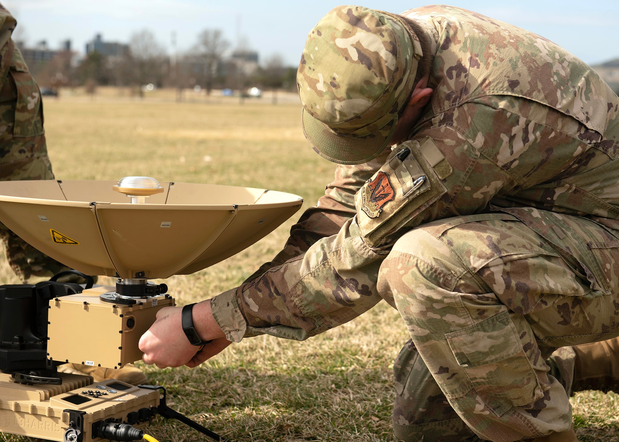 U.S. Air Force Tech. Sgt. Tony Robertson, 70th Intelligence, Surveillance and Reconnaissance Wing National Tactical Integration mission manager, prepares to activate a mobile radar, March 1, 2023, at Fort George G. Meade, Maryland. The test provided intel Airmen the experience to service, test, and tear-down mobile equipment, that simulate situations in an austere environment. (U.S. Air Force phot by Staff Sgt. Kevin Iinuma)