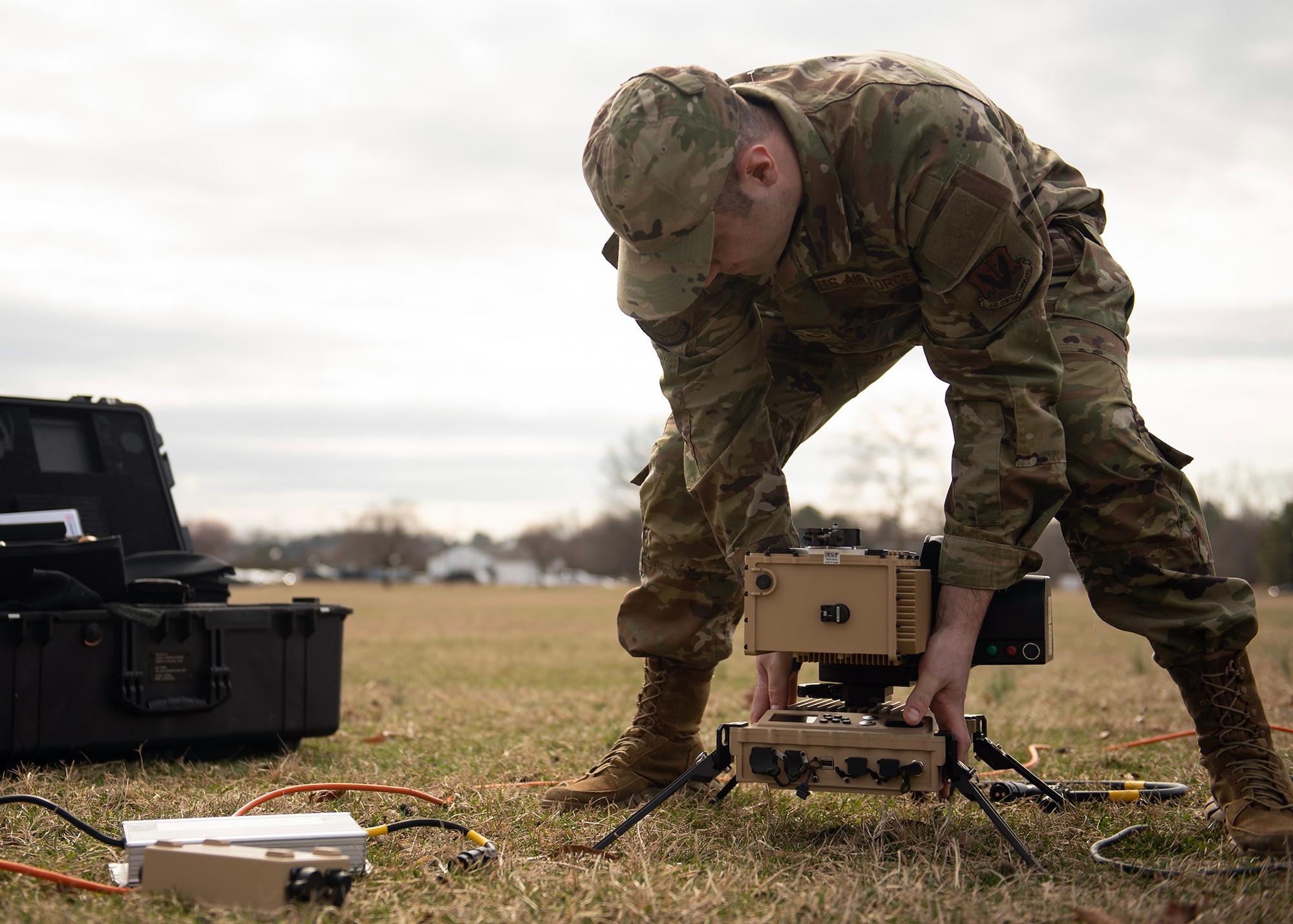 U.S. Air Force Senior Airman Kurtis Knights, 29th Intelligence Squadron target development network analyst, assembles a mobile radar, March 1, 2023, at Fort George G. Meade, Maryland. The test provided intel Airmen the experience to service, test, and tear-down mobile equipment, that simulate situations in an austere environment. As the lead wing for Air Force National Tactical Integration, 70th ISRW, is leading the way in training analysts to leverage intelligence community capabilities that can enhance Air Component operations around the world. (U.S. Air Force phot by Staff Sgt. Kevin Iinuma)