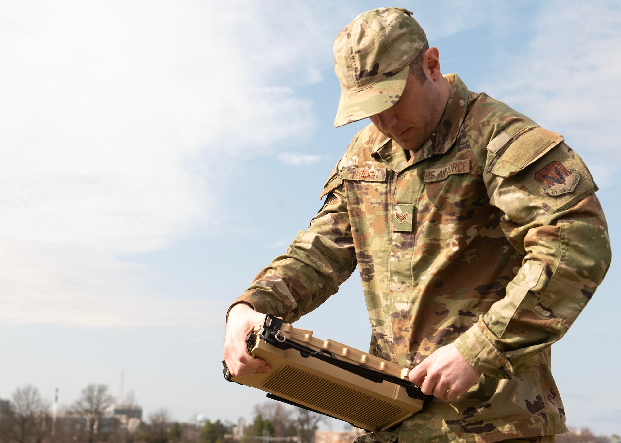 U.S. Air Force Senior Airman Kurtis Knights, 29th Intelligence Squadron target development network analyst, assembles a mobile radar, March 1, 2023, at Fort George G. Meade, Maryland. The radar is the second generation of its kind, providing mobile communications with an end-to-end connection worldwide. Intel Airmen tested the mobile equipment, to gain a better understanding of how to operate the device when used in austere environments. (U.S. Air Force phot by Staff Sgt. Kevin Iinuma)