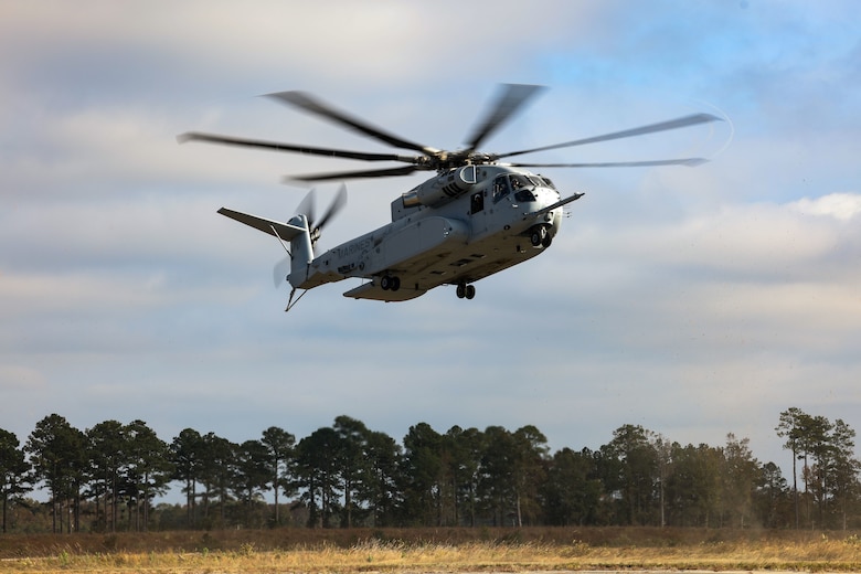 Marines with Marine Forces Special Operations Command and 2nd Marine Logistics Group evaluate secondary mission capabilities of the CH-53K King Stallion helicopter in the vicinity of Marine Corps Air Station Cherry Point, Oct. 25, 2022. The evaluation included day and night aerial cargo delivery, low-level static line parachute operations, and military freefall operations. (U.S. Marine Corps photo by Sgt. Jesula Jeanlouis)