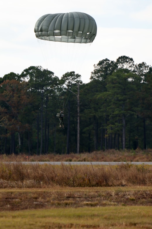 A crash test dummy approaches a landing zone during an evaluation of the CH-53K King Stallion helicopter in the vicinity of Marine Corps Air Station Cherry Point, Oct. 25, 2022. Paraloft personnel first used crash test dummies to ensure the aircraft and tail rotor would not impede parachute deployment bags or hanging lines. (U.S. Marine Corps photo by Sgt. Jesula Jeanlouis)
