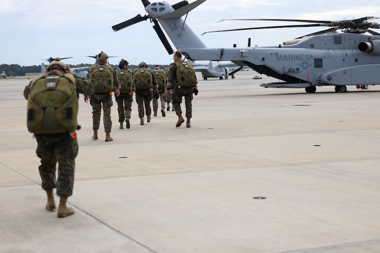 Marines with Marine Forces Special Operations Command prepare to board a CH-53K King Stallion helicopter during an evaluation of the aircraft in the vicinity of Marine Corps Air Station Cherry Point, Oct. 25, 2022. The evaluation included day and night aerial cargo delivery, low-level static line parachute operations, and military freefall operations. (U.S. Marine Corps photo by Sgt. Jesula Jeanlouis)