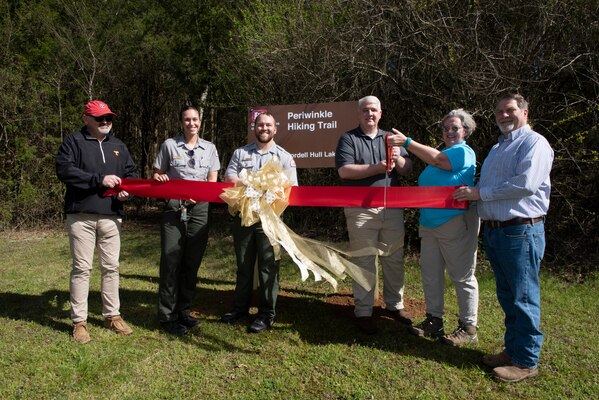 (Left to Right) Smith County Mayor Jeff Mason, Park Ranger Luciana Arena, Park Ranger Brad Potts, Cordell Hull Lake resource manager Kenny Claywell, Natasha Deane, owner of Wildwood Resort & Marina and chairperson of Friends of Cordell Hull Lake, and Jackson County Mayor Randy Heady cut a ribbon to dedicate Periwinkle Hiking Trail March 25, 2023, at the Indian Creek Archery Range Trailhead in Granville, Tennessee. (USACE Photo by Lee Roberts)