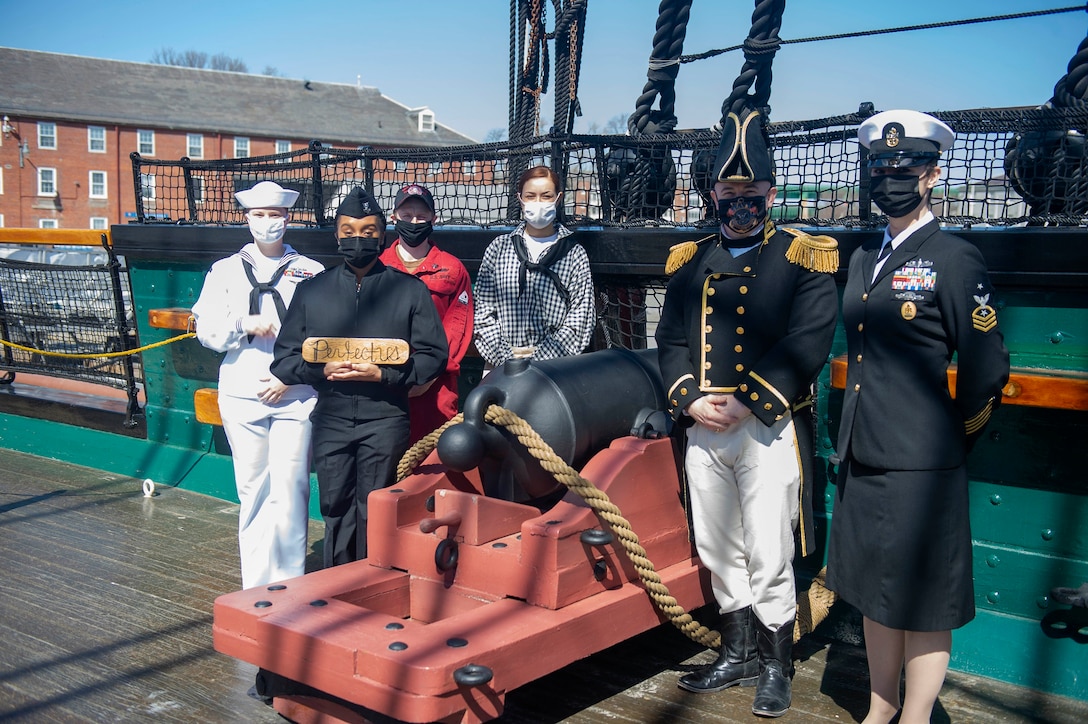 BOSTON March 21, 2021) Sailors assigned to USS Constitution pose for a photo. Constitution, the world's oldest commissioned warship afloat, played a crucial role in the Barbary Wars and the War of 1812, actively defending sea lanes from 1797 to 1855. Designated America's Ship of State, Constitution and its crew engage in community outreach and education about the ship's history and the importance of naval power to more than 500,000 visitors each year. (U.S. Navy photo by Mass Communication Specialist 2nd Class Joshua Samoluk/Released)